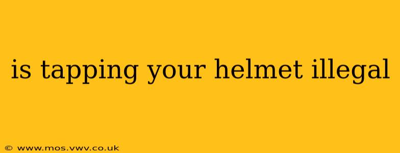 is tapping your helmet illegal
